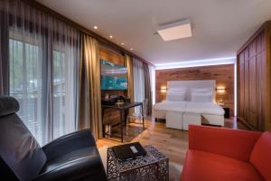 Televízia a/alebo spoločenská miestnosť v ubytovaní Alpinresort ValSaa - Sport & Spa