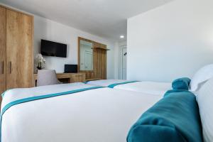 Postel nebo postele na pokoji v ubytování Hotel Porat