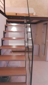 a set of stairs leading up to a room at MandorleOlio in Polignano a Mare