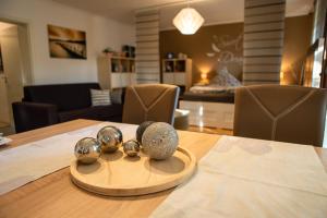 a wooden table with balls on top of it at Haus Talblick in Freudenstadt