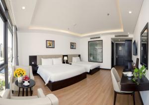 Rúm í herbergi á Golden Line Hotel Danang