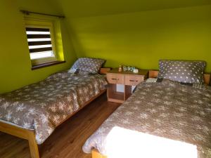 Postel nebo postele na pokoji v ubytování Domek u Mariusza