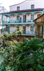 an old house with a blue and white at Hotel VIP in Tbilisi City