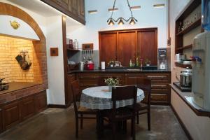 A kitchen or kitchenette at CHARAKAMA Guest Bungalow - GAMPAHA