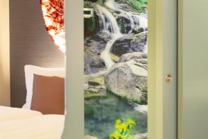 Letto o letti in una camera di Cascada Boutique Hotel