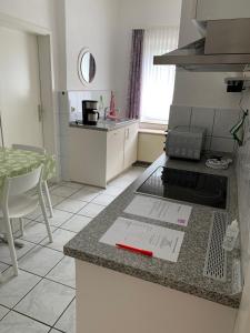 a kitchen with a counter with a red object on it at Ferienwohnung Bünger in Essel