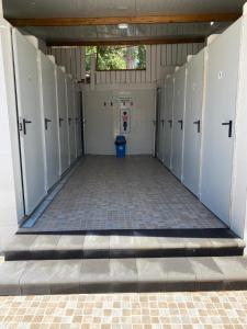 a row of white lockers in a building at Villaggio Togo Togo in Vulcano