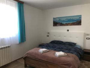 Postel nebo postele na pokoji v ubytování MM Apartmani