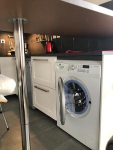 a white washer and dryer in a kitchen at Chez Lio & Jess in Obernai