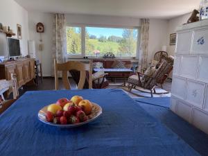 a bowl of fruit on a table in a kitchen at Haus Gutach in Schönwald