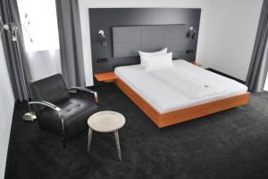 Postel nebo postele na pokoji v ubytování Hotel zum Rössel