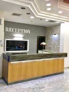 a hotel reception desk in a hotel lobby at Berger Hotel in Tiberias
