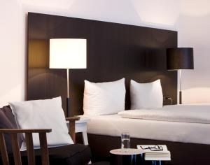 Postel nebo postele na pokoji v ubytování Hotel zum Rössel