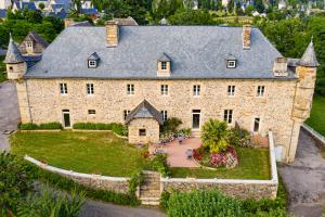 an aerial view of a large stone house at Château de la Falque, The Originals Relais in Saint-Geniez-dʼOlt