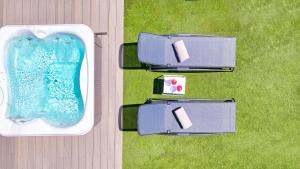 eine Aussicht auf einen Pool im Gras in der Unterkunft Club Maspalomas Suites & Spa - Adults Only in Maspalomas