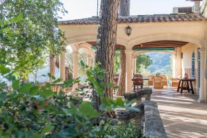 an outside view of a house with a patio at Raco de Soller in Sóller