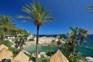 a view of the beach from the resort at Arbatax Park Resort - Ville del Parco in Àrbatax