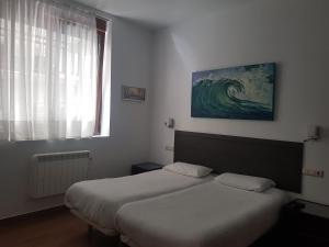 Postel nebo postele na pokoji v ubytování Pensión Atxiki