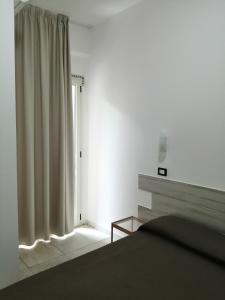 Кровать или кровати в номере Hotel Brennero