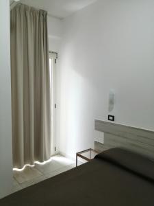 Postel nebo postele na pokoji v ubytování Hotel Brennero + 17 fotografií