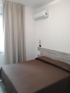 Tempat tidur dalam kamar di Hotel Brennero