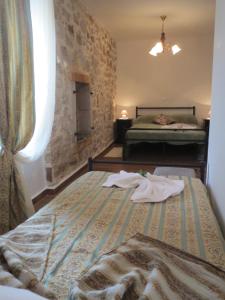 a bedroom with a bed with towels on it at Villa zita in Poreč