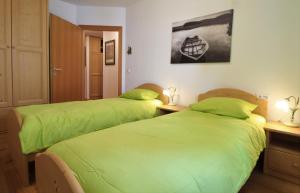 Łóżko lub łóżka w pokoju w obiekcie Family Apartment FUCHS Bad Kleinkirchheim