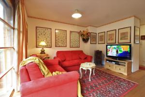 Telewizja i/lub zestaw kina domowego w obiekcie Family Apartment FUCHS Bad Kleinkirchheim