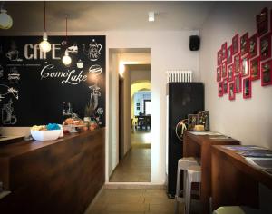 a restaurant with a counter with a sign on the wall at Mamma Ciccia in Mandello del Lario