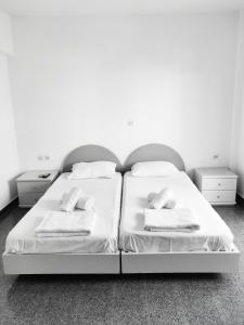 Postel nebo postele na pokoji v ubytování Atrium Apartment #2