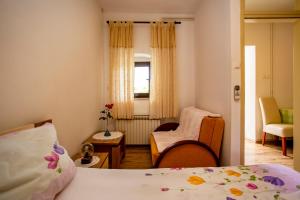 Postel nebo postele na pokoji v ubytování Apartmani Jurman