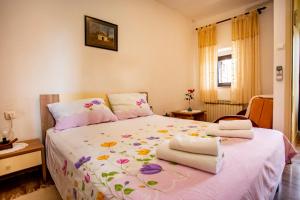 Postel nebo postele na pokoji v ubytování Apartmani Jurman
