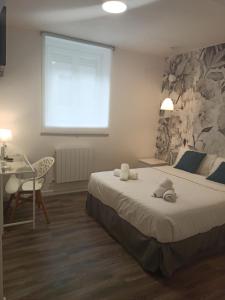 Łóżko lub łóżka w pokoju w obiekcie Rin Rooms