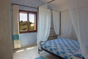 Ένα ή περισσότερα κρεβάτια σε δωμάτιο στο Terrazza sulla Pelosa