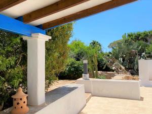 a view of a patio with a pergola at Can Xicu Castello in Sant Ferran de Ses Roques