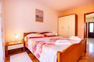 Postel nebo postele na pokoji v ubytování Apartmani Jurman