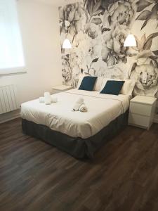 Łóżko lub łóżka w pokoju w obiekcie Rin Rooms