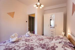 Postel nebo postele na pokoji v ubytování Apartmani Jurman