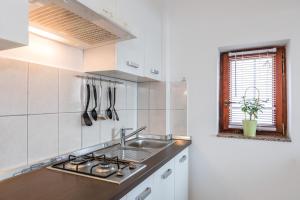 a kitchen with a sink and a counter top at Apartments Mikanović in Crikvenica