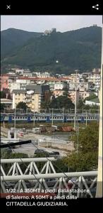 a view of a city with a train at Casa vacanza Arcangeli in Salerno