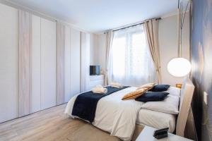 A bed or beds in a room at Casapalestro8#1