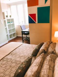 Een bed of bedden in een kamer bij 7Rios Rooms