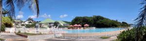 a swimming pool at a resort with a resort at COZY Studio 331 ADR in Saint-François