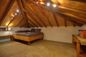 a bedroom with a bed in a room with wooden ceilings at Angel Sunset suite in Patitiri +30 photos