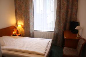 Postel nebo postele na pokoji v ubytování Alameda