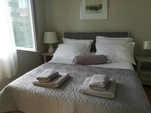 Postel nebo postele na pokoji v ubytování Apartmani Vidoš