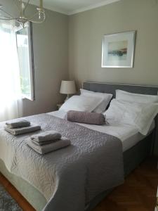 Postel nebo postele na pokoji v ubytování Apartmani Vidoš