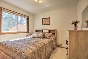 a bedroom with a bed and a window at Lake Superior Beachfront Home - 15 Mi to Duluth! in Clifton