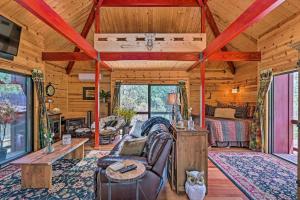 a cabin living room with a couch and a table at Furnished Deck Romantic StrawberryandPine Studio! in Pine