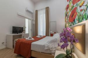 Postel nebo postele na pokoji v ubytování Hotel Mimosa Pantheon